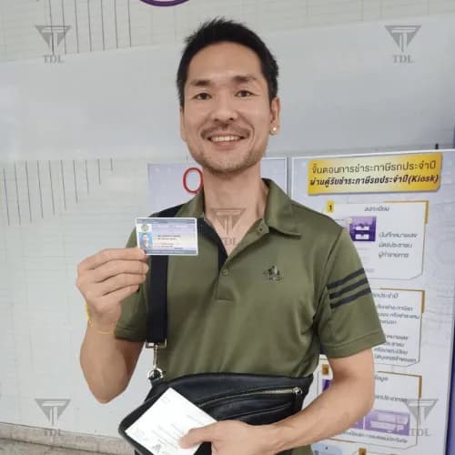 Client at DLT office for vehicle transfer